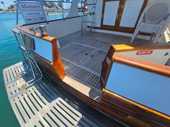 Marytime Yacht Photos Pics 1987 Grand Banks 42 Europa yacht deck with wooden finish and swim platform.