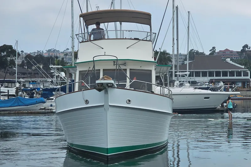 Marytime Yacht Photos Pics 1987 Grand Banks 42 Europa yacht docked in a marina, front view.