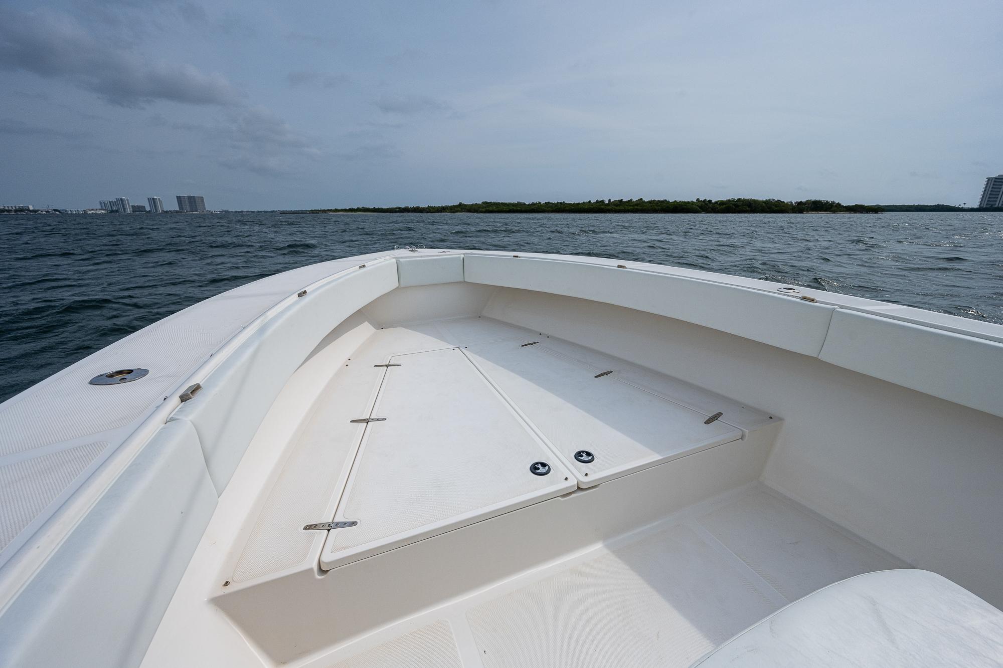 Venture 34 Open CC 1999 on calm sea with island in background.