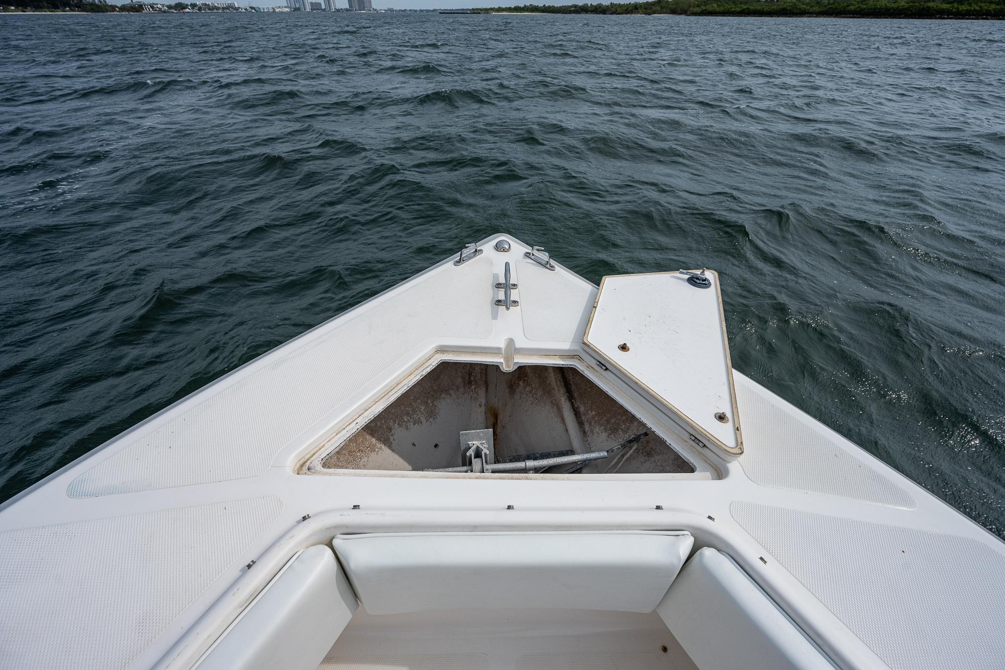 Bow of a 1999 Venture 34 Open CC on the water.