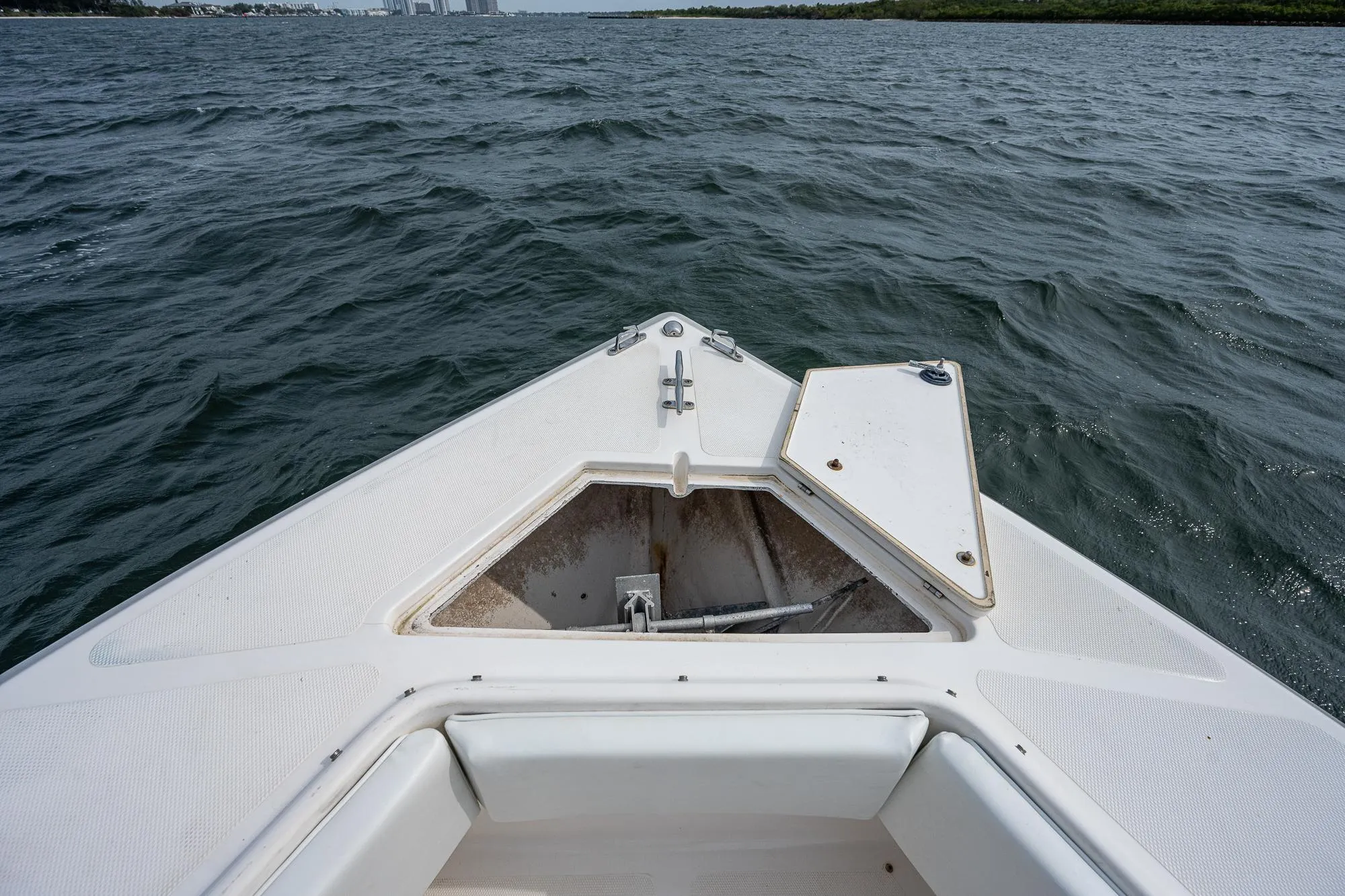 Bow of a 1999 Venture 34 Open CC on the water.