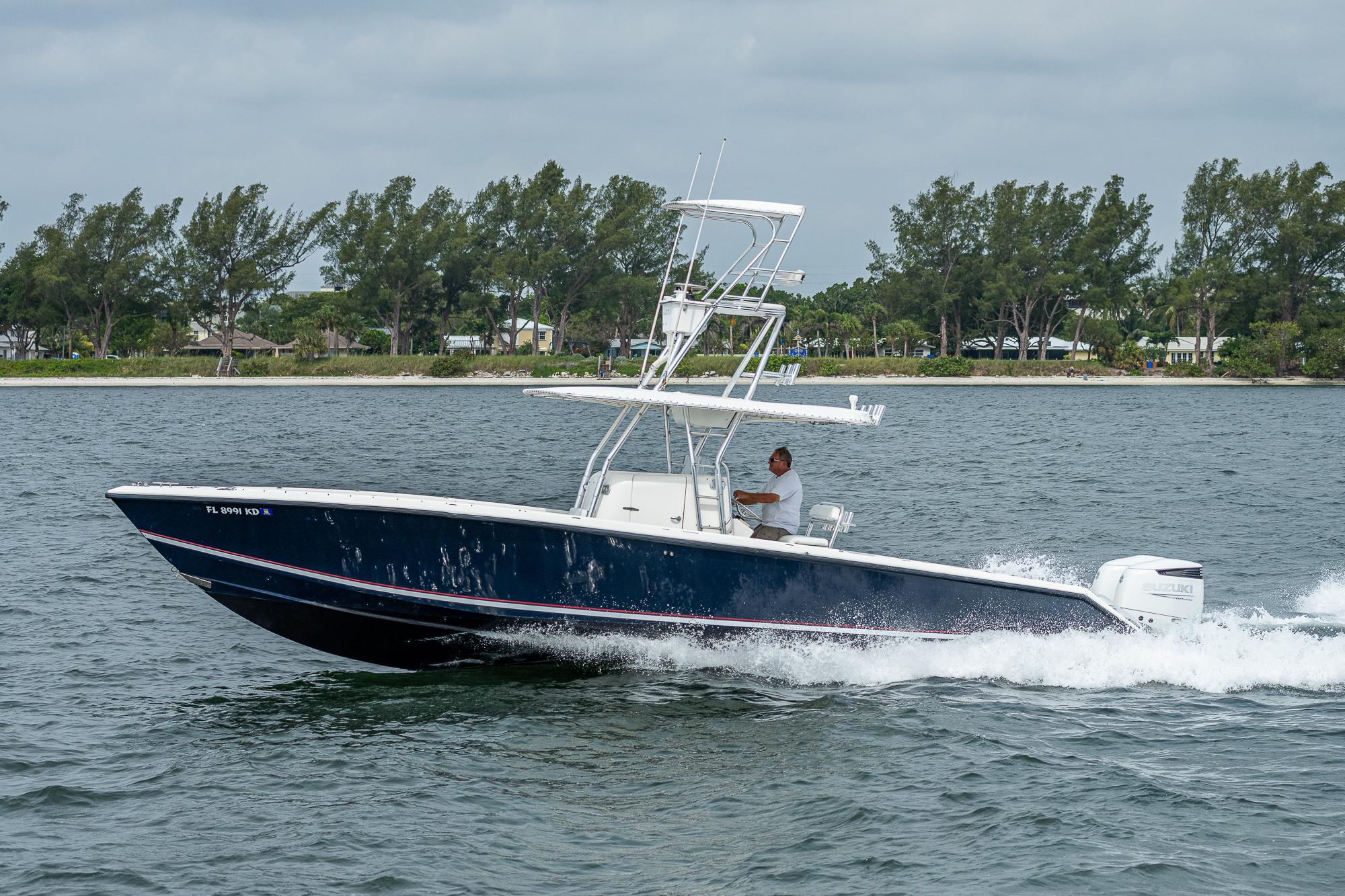 1999 Venture 34 Open CC boat on the water.