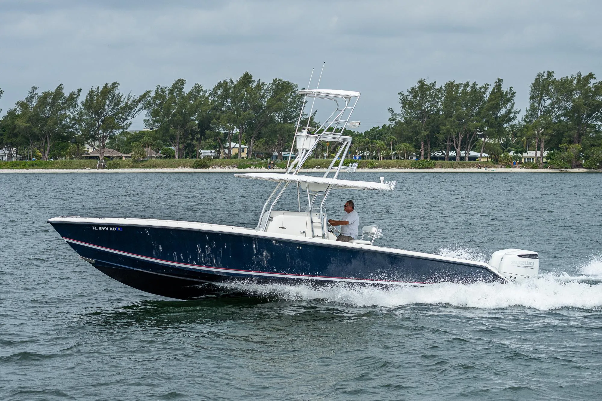 1999 Venture 34 Open CC boat on the water.