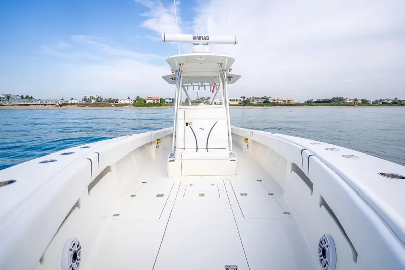 Yacht Photos Pics 2014 SeaVee 34 boat on calm water, showcasing spacious deck and modern design.