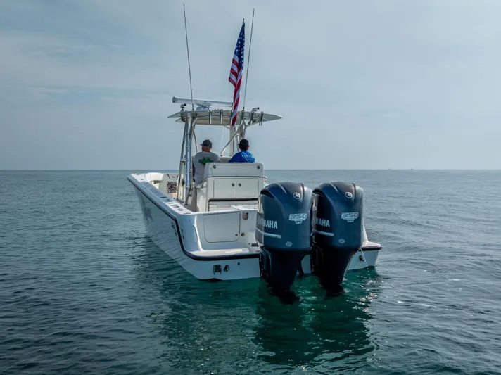  Yacht Photos Pics 2014 SeaVee 34 boat with dual Yamaha engines on calm ocean waters.