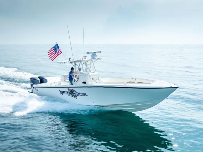  Yacht Photos Pics 2014 SeaVee 34 boat cruising on open water with American flag.