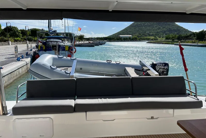 Portlish Yacht Photos Pics 2022 Fountaine Pajot Tanna 47 yacht docked with scenic waterway view.