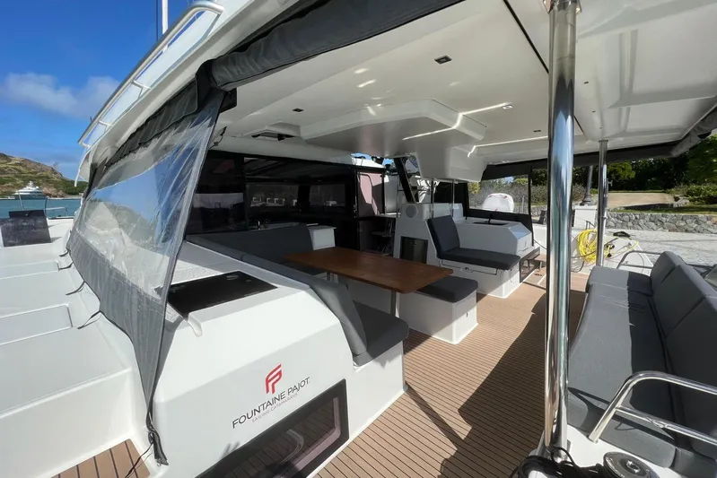 Portlish Yacht Photos Pics Luxurious 2022 Fountaine Pajot Tanna 47 catamaran interior with spacious seating and dining area.