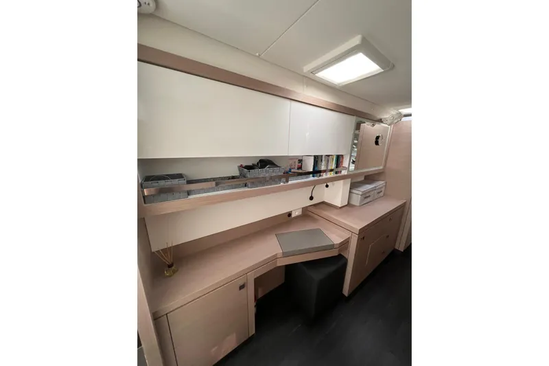 Portlish Yacht Photos Pics Interior of 2022 Fountaine Pajot Tanna 47 yacht with modern desk and storage.