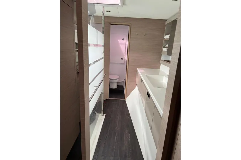 Portlish Yacht Photos Pics Modern bathroom interior of 2022 Fountaine Pajot Tanna 47 yacht, featuring sleek design and fixtures.