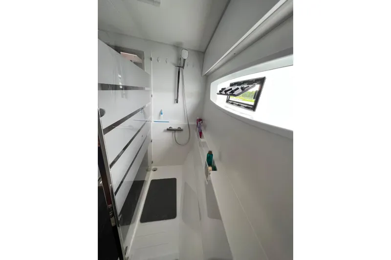 Portlish Yacht Photos Pics Modern bathroom interior of 2022 Fountaine Pajot Tanna 47 yacht with sleek design.