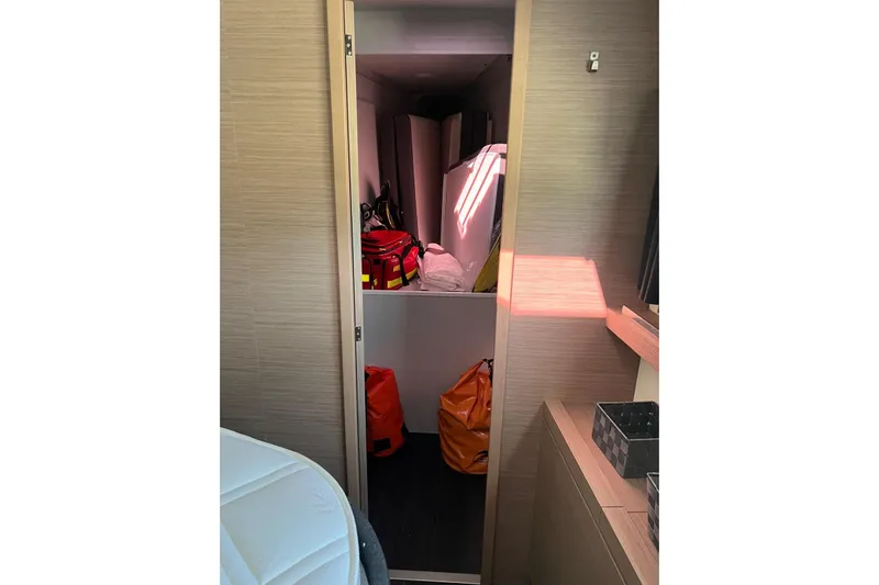Portlish Yacht Photos Pics Interior storage space on 2022 Fountaine Pajot Tanna 47 yacht, featuring organized compartments.