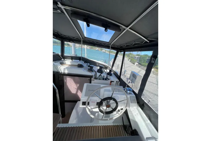 Portlish Yacht Photos Pics 2022 Fountaine Pajot Tanna 47 yacht helm with panoramic views and modern navigation equipment.