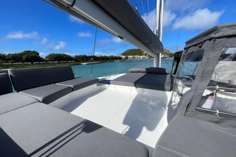 Portlish Yacht Photos Pics Luxurious 2022 Fountaine Pajot Tanna 47 catamaran with spacious deck and scenic water view.