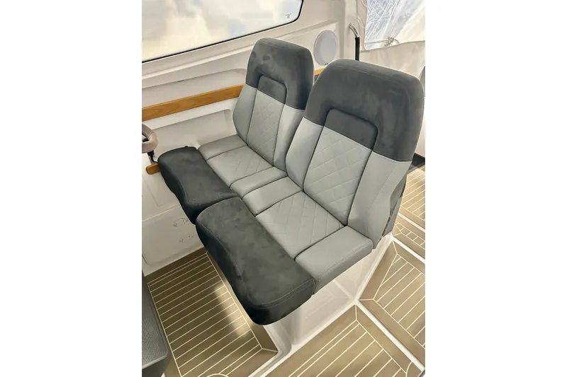Delphin Yacht Photos Pics 2023 Nimbus Weekender 9 interior seating with modern, quilted upholstery design.