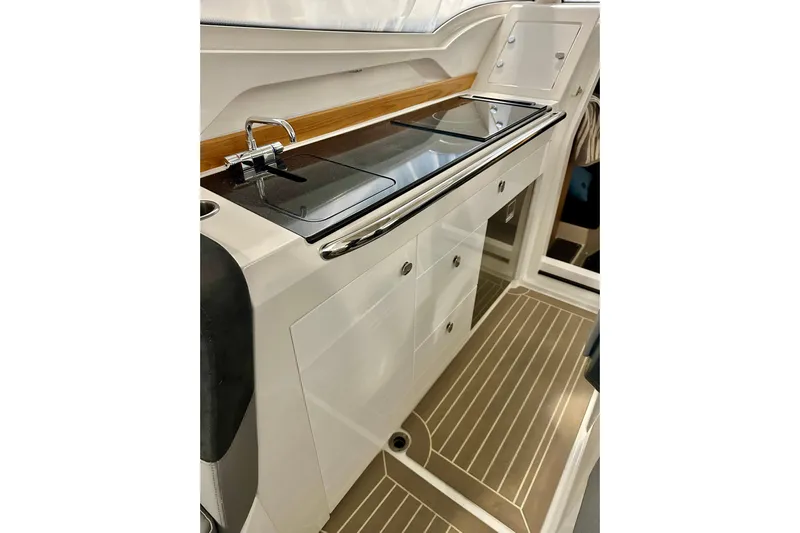 Delphin Yacht Photos Pics 2023 Nimbus Weekender 9 boat interior with sleek kitchenette and modern design.
