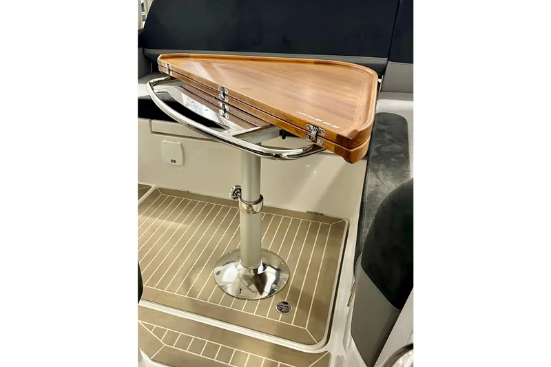 Delphin Yacht Photos Pics 2023 Nimbus Weekender 9 interior with elegant wooden table and sleek design.