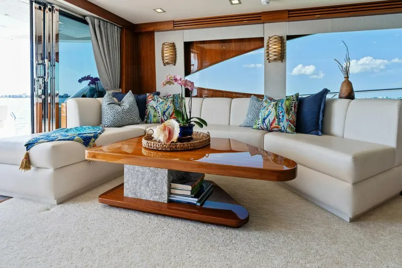 Mana Yacht Photos Pics Luxurious interior of 2021 Viking 82 Cockpit Motor Yacht with elegant seating and decor.