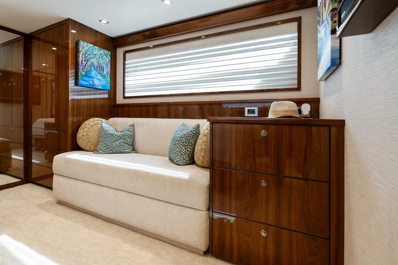 Mana Yacht Photos Pics Luxurious interior of 2021 Viking 82 Cockpit Motor Yacht with elegant wood finishes.