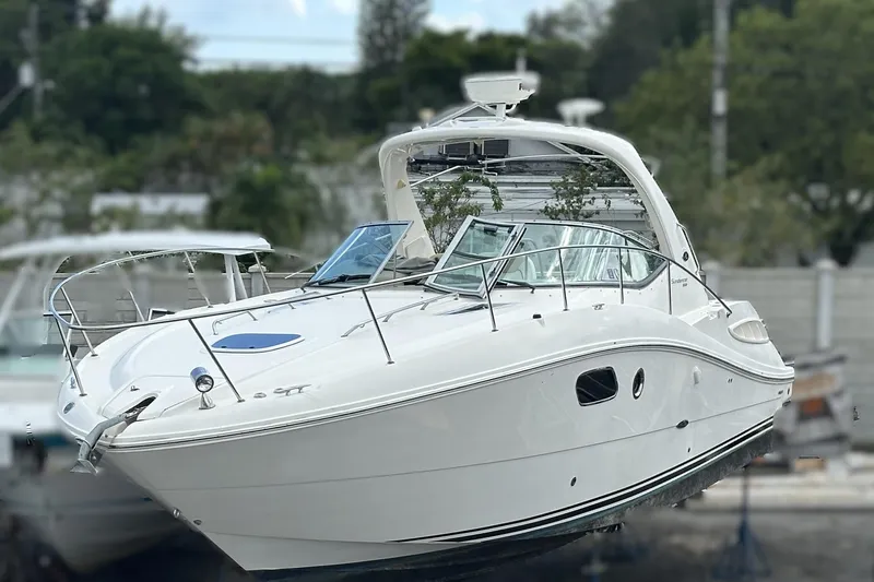  Yacht Photos Pics 2010 Sea Ray 350 Sundancer boat on display, featuring sleek white design and modern amenities.