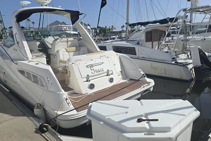  Yacht Photos Pics 2010 Sea Ray 350 Sundancer yacht docked at marina, featuring spacious deck and elegant design.