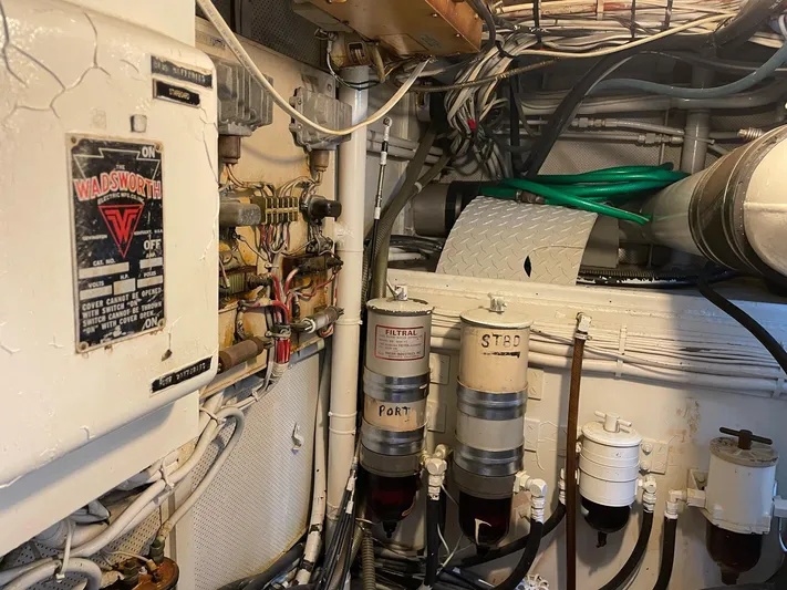  Yacht Photos Pics Engine room of a 1965 Burger 78' Cockpit Flybridge Motor Yacht with electrical and fuel systems.