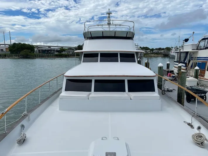  Yacht Photos Pics 1965 Burger 78' Cockpit Flybridge Motor Yacht docked at a marina.