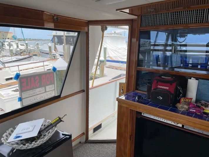  Yacht Photos Pics Interior view of 1965 Burger 78' Cockpit Flybridge Motor Yacht for sale at marina.