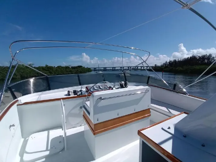  Yacht Photos Pics 1965 Burger 78' Cockpit Flybridge Motor Yacht on a sunny day, river view.