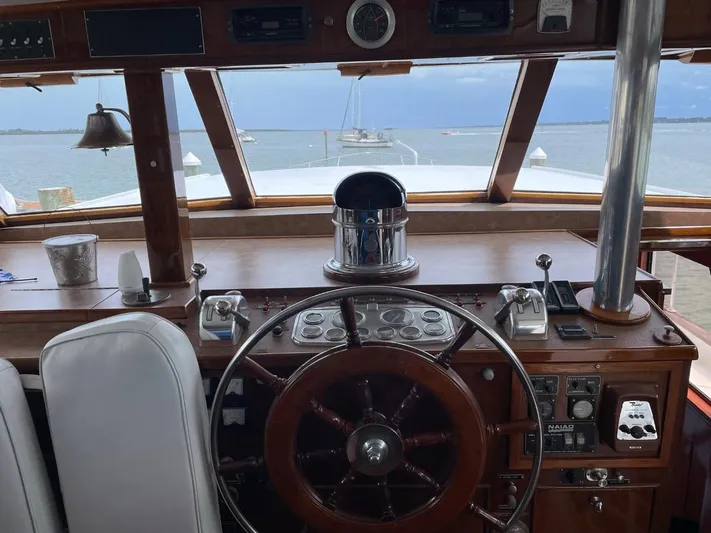  Yacht Photos Pics Cockpit view of 1965 Burger 78' Flybridge Motor Yacht with wooden steering wheel.