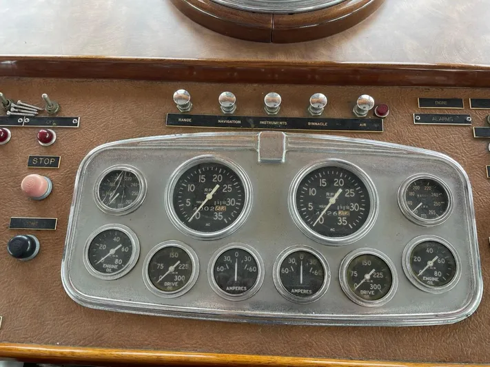  Yacht Photos Pics Control panel of a 1965 Burger 78' Cockpit Flybridge Motor Yacht with gauges and switches.