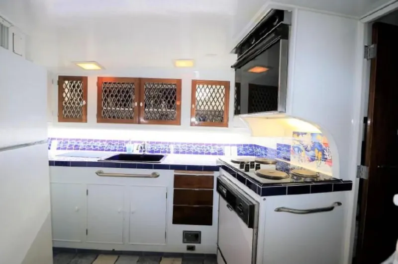  Yacht Photos Pics Galley kitchen in 1965 Burger 78' Cockpit Flybridge Motor Yacht with modern appliances.