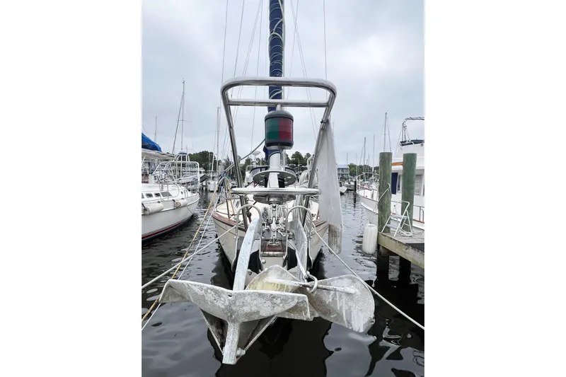 Delicia Yacht Photos Pics 1995 Island Packet 40 sailboat docked, featuring dual anchors and a mast.