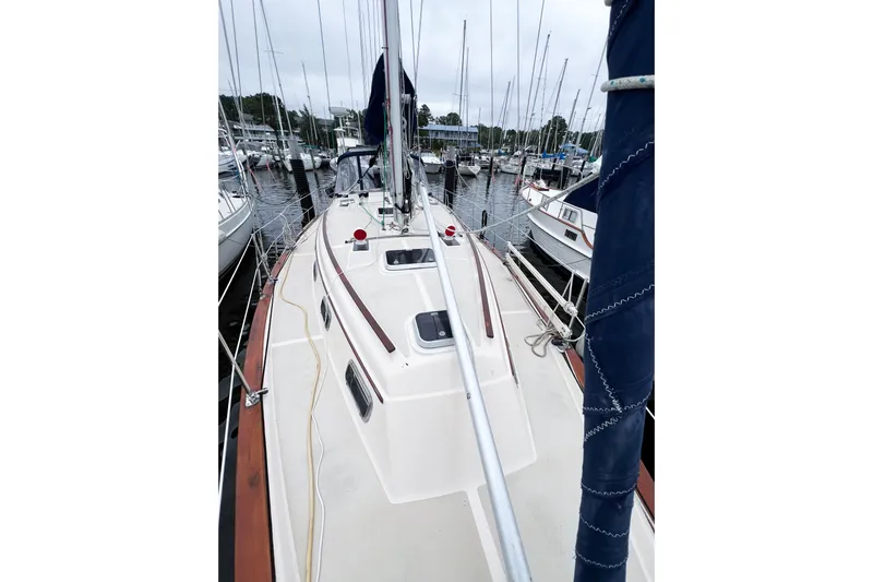 Delicia Yacht Photos Pics 1995 Island Packet 40 sailboat docked at marina, showcasing deck and rigging.
