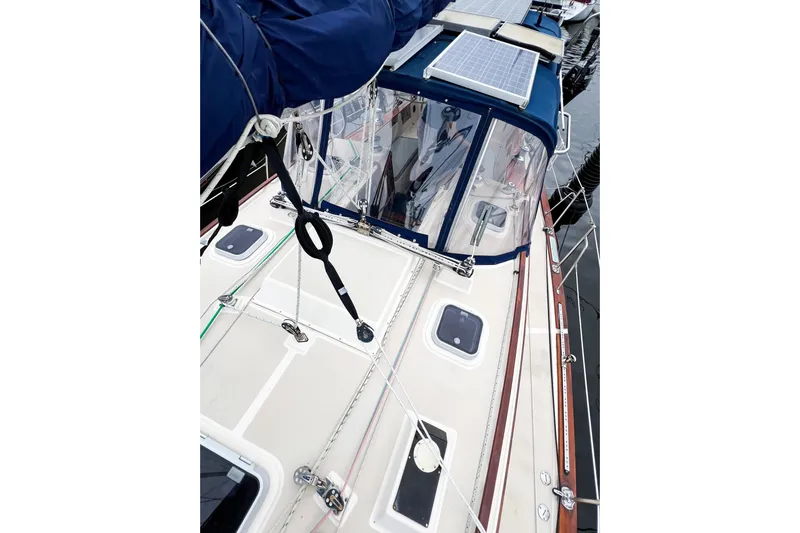 Delicia Yacht Photos Pics 1995 Island Packet 40 sailboat deck with solar panels and rigging details.