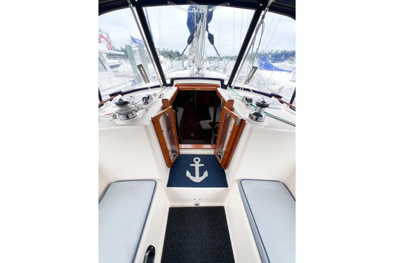 Delicia Yacht Photos Pics Cockpit view of 1995 Island Packet 40 sailboat with open cabin doors and anchor mat.