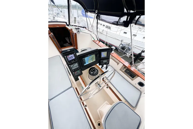 Delicia Yacht Photos Pics Cockpit of 1995 Island Packet 40 sailboat with navigation instruments and steering wheel.