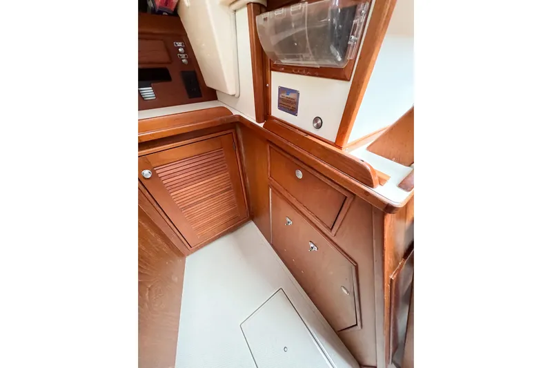 Delicia Yacht Photos Pics Interior view of 1995 Island Packet 40 sailboat with wooden cabinetry.