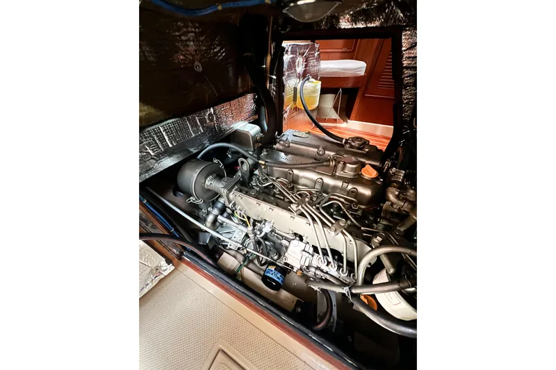 Delicia Yacht Photos Pics Engine compartment of a 1995 Island Packet 40 sailboat, showcasing detailed mechanical components.