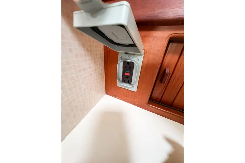 Delicia Yacht Photos Pics Electrical outlet with cover on 1995 Island Packet 40 yacht interior.