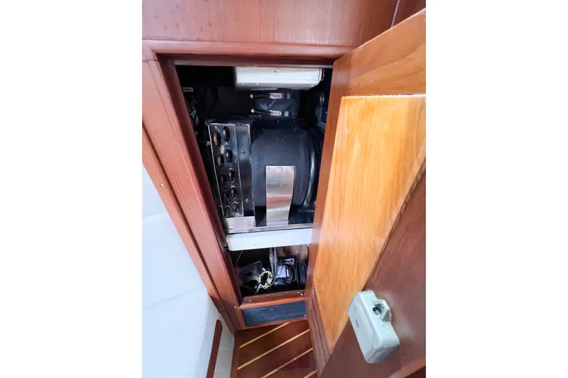 Delicia Yacht Photos Pics Engine compartment of a 1995 Island Packet 40 sailboat, showcasing mechanical components.