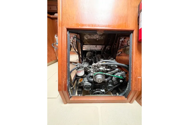 Delicia Yacht Photos Pics Engine compartment of a 1995 Island Packet 40 sailboat, showcasing mechanical components.
