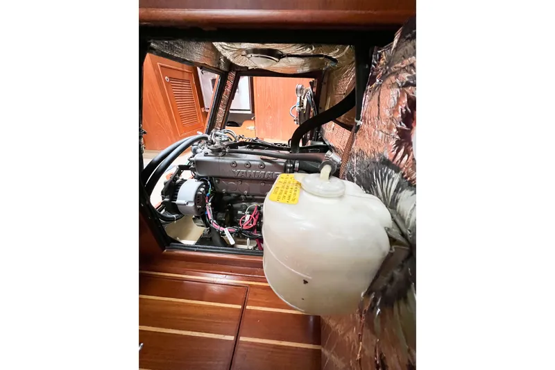 Delicia Yacht Photos Pics Engine compartment of a 1995 Island Packet 40 sailboat, featuring a Yanmar engine.