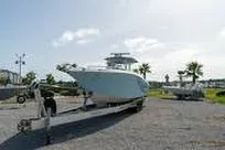 Reel Fed Up Yacht Photos Pics 2007 Fountain 38 Tournament Edition boat on trailer in sunny outdoor setting.