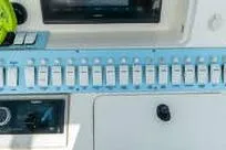 Reel Fed Up Yacht Photos Pics Control panel of a 2007 Fountain 38 Tournament Edition boat with switches and gauges.