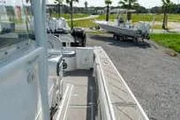 Reel Fed Up Yacht Photos Pics 2007 Fountain 38 Tournament Edition boat on a sunny day, parked near a grassy area.