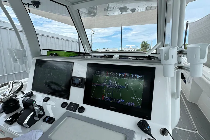  Yacht Photos Pics Helm of 2025 Front Runner 43 Catamaran with dual screens and modern controls.