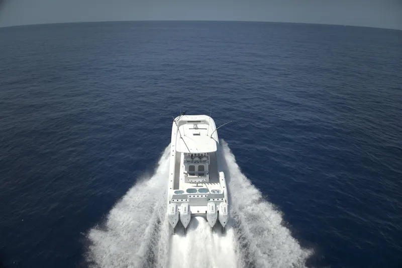  Yacht Photos Pics 2025 Front Runner 43 Catamaran cruising on open ocean waters.