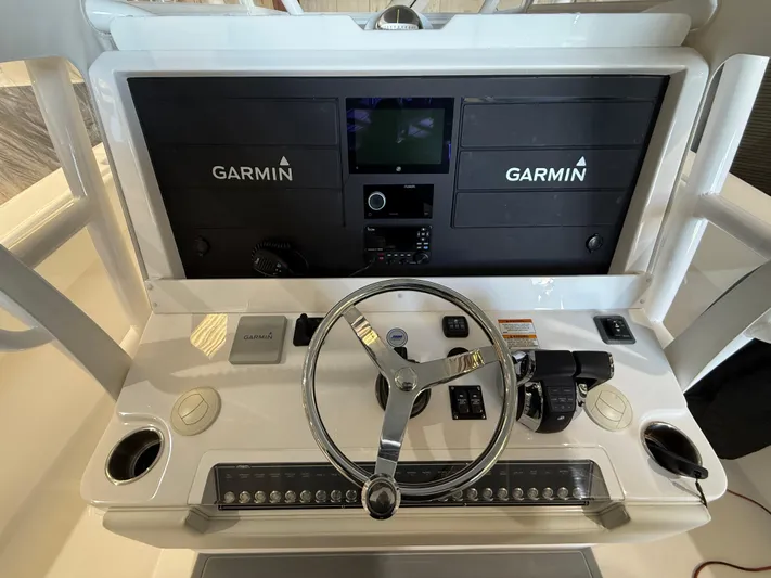  Yacht Photos Pics 2022 Invincible 39 Open Fisherman helm with Garmin navigation system.