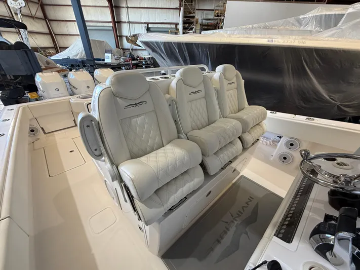  Yacht Photos Pics 2022 Invincible 39 Open Fisherman boat with luxurious seating in a spacious cockpit.